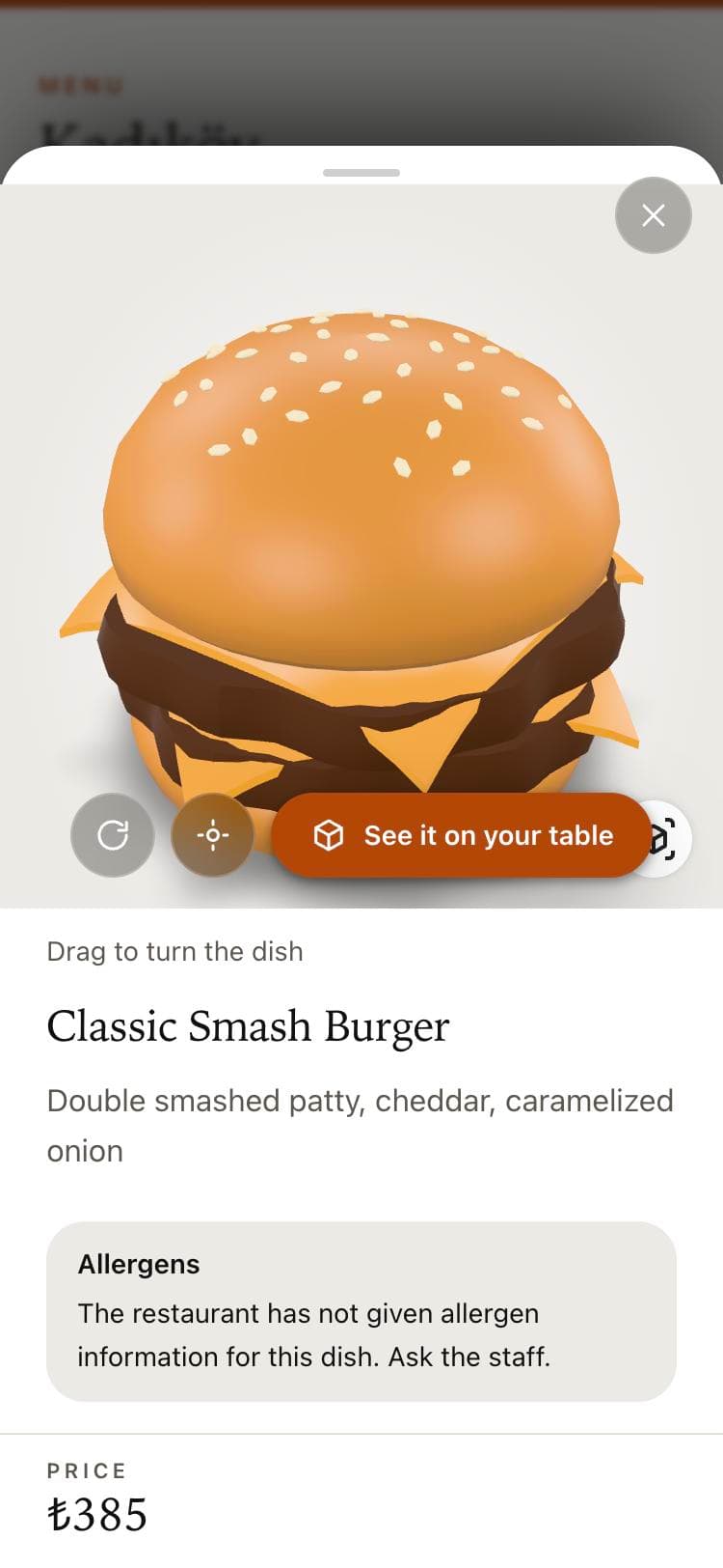 A dish opened on a phone, rendered in 3D, with a 'See it on your table' button.